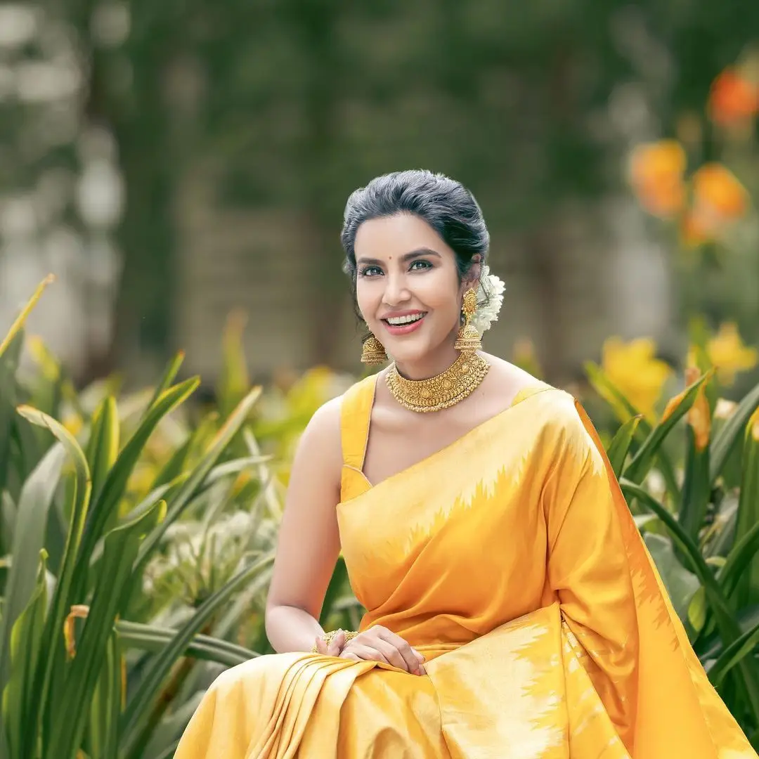 Actress Priya Anand Images in Yellow Color Saree Sleeveless Blouse